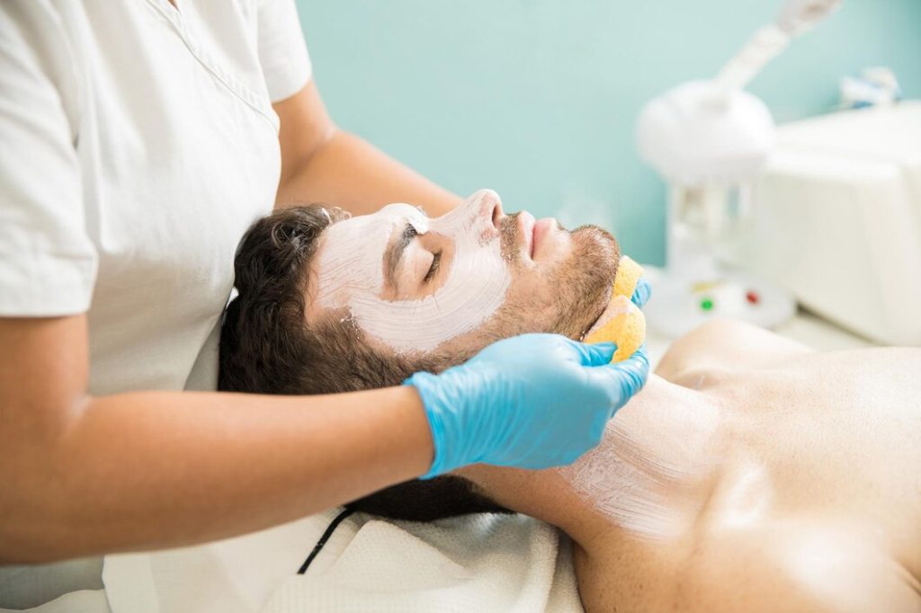 Current image: Man receiving a professional facial treatments at an aesthetic clinic in Dubai